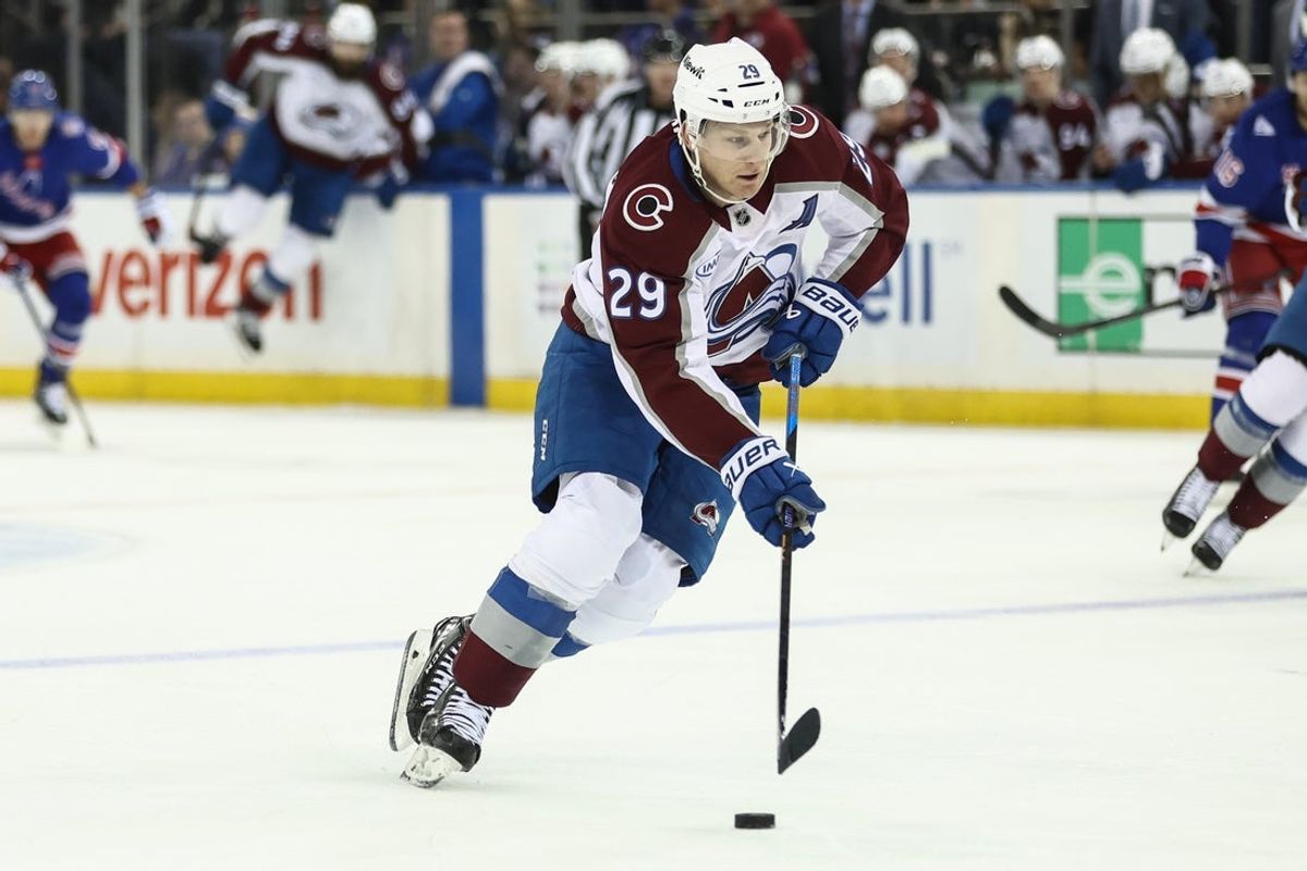 Dec 6, 2025; New York, New York, USA;  Colorado Avalanche center Nathan MacKinnon (29) controls the puck in the first period against the New York Rangers at Madison Square Garden. Mandatory Credit: Wendell Cruz-Imagn Images