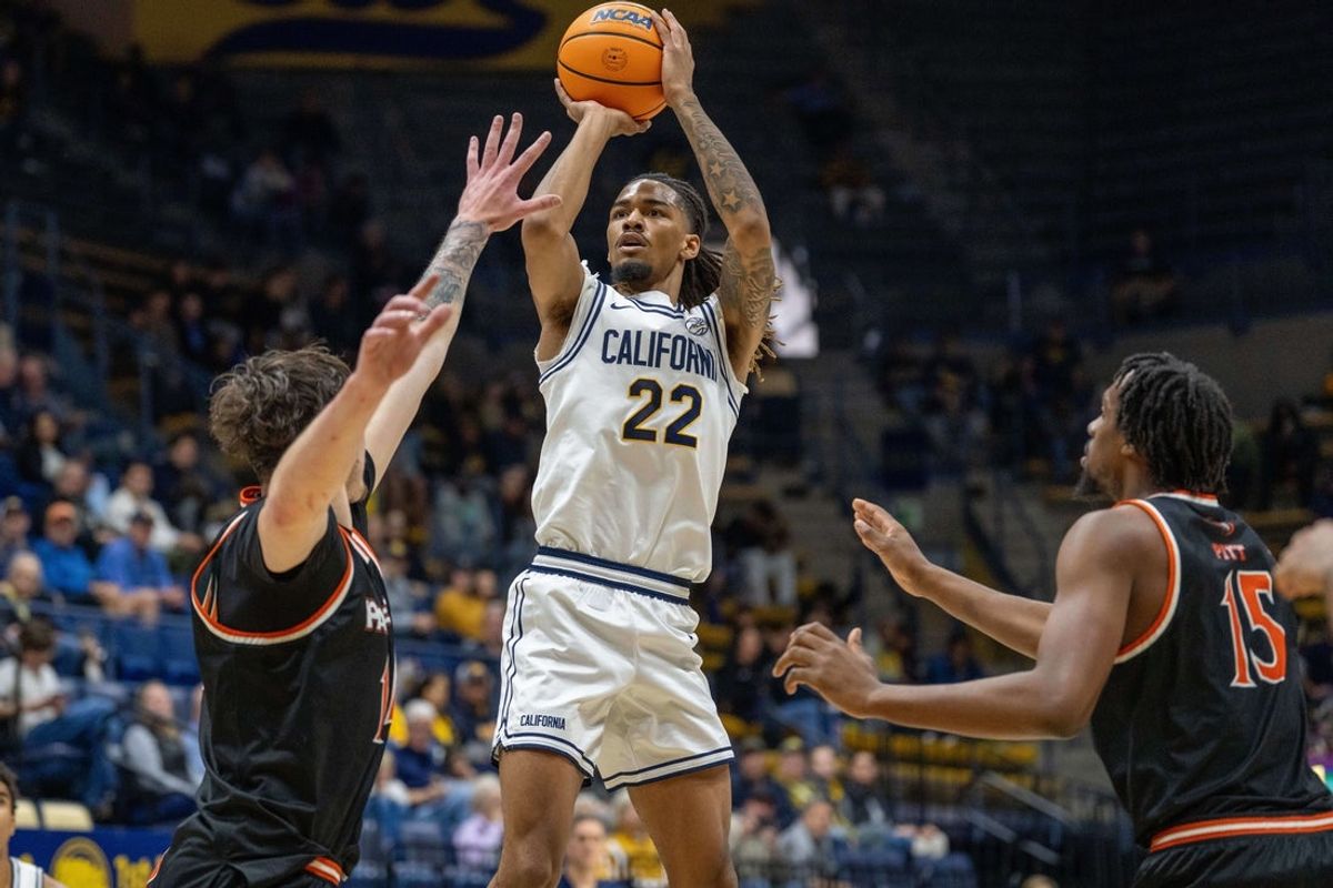Dec 6, 2025; Berkeley, California, USA; California Golden Bears forward Chris Bell (22) shoots the basketball over Pacific Tigers center Isaac Jack (14) during the first half at Haas Pavilion. Mandatory Credit: Neville E. Guard-Imagn Images