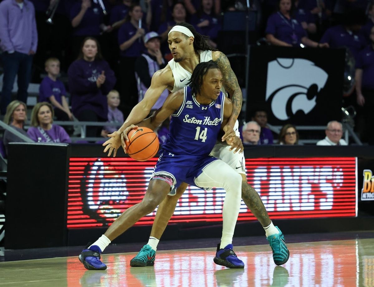 Dec 6, 2025; Manhattan, Kansas, USA; Seton Hall Pirates guard AJ Staton-McCray (14) is guarded by Kansas State Wildcats guard Nate Johnson (34) during the second half at Bramlage Coliseum. Mandatory Credit: Scott Sewell-Imagn Images