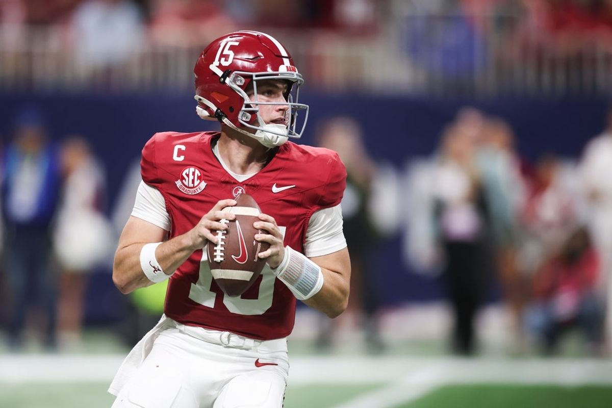 Dec 6, 2025; Atlanta, GA, USA; Alabama Crimson Tide quarterback Ty Simpson (15) looks to pass during the fourth quarter against the Georgia Bulldogs during the 2025 SEC Championship game at Mercedes-Benz Stadium. Mandatory Credit: Brett Davis-Imagn Images