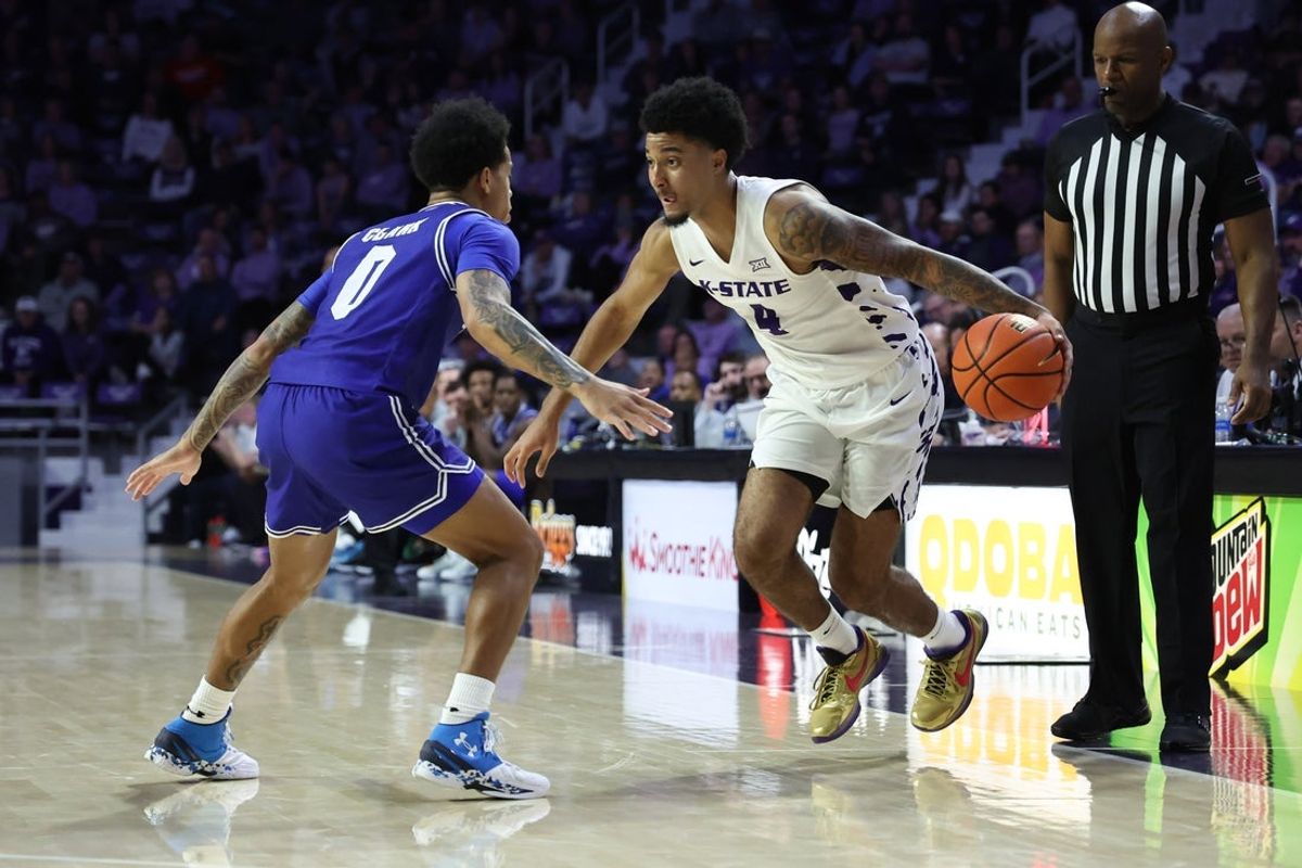 Dec 6, 2025; Manhattan, Kansas, USA; Kansas State Wildcats guard P.J. Haggerty (4) dribbles against Seton Hall Pirates guard Adam Clark (0) during the second half at Bramlage Coliseum. Mandatory Credit: Scott Sewell-Imagn Images