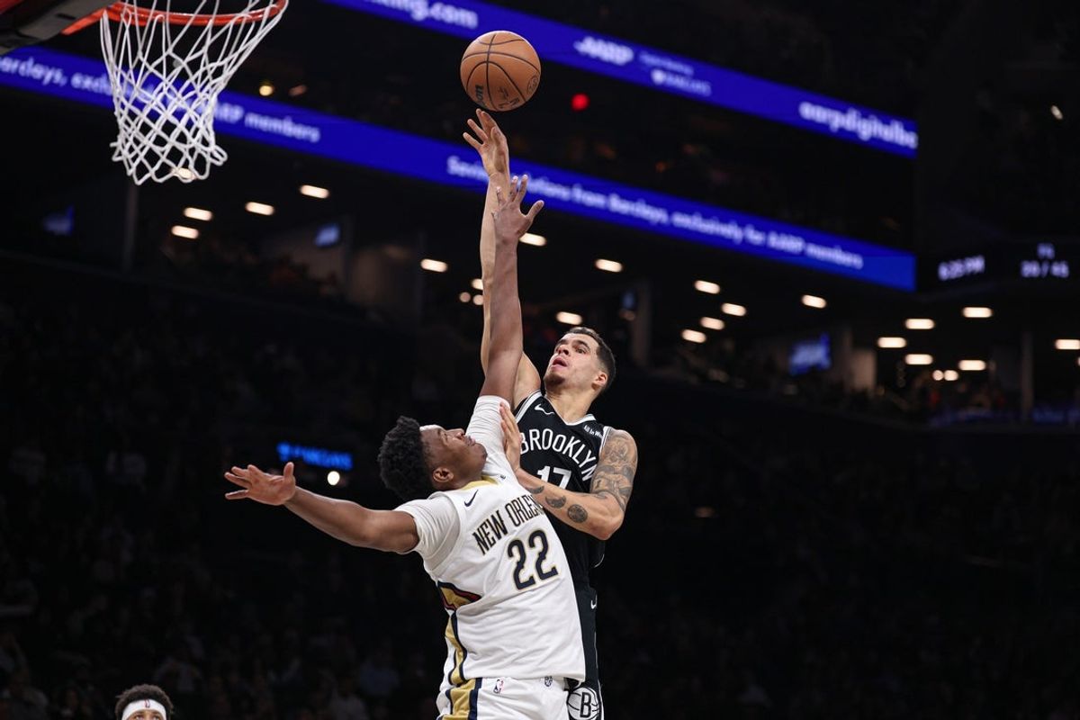 Dec 6, 2025; Brooklyn, New York, USA; Brooklyn Nets forward Michael Porter Jr. (17) goes to the basket againstNew Orleans Pelicans center Derik Queen (22) during the second half at Barclays Center. Mandatory Credit: Vincent Carchietta-Imagn Images