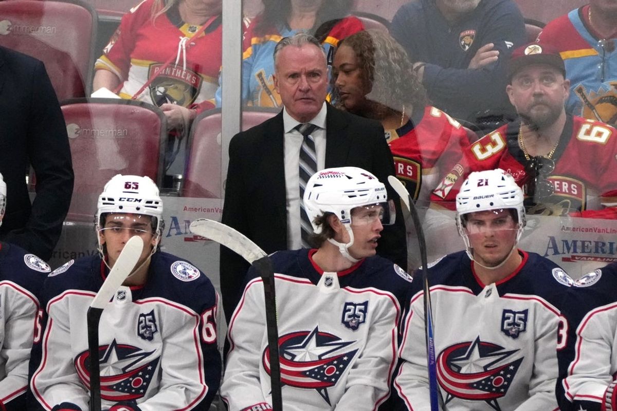 Dec 6, 2025; Sunrise, Florida, USA;  Columbus Blue Jackets head coach Dean Evason keeps an eye on his team during the third period against the Florida Panthers at Amerant Bank Arena. Mandatory Credit: Jim Rassol-Imagn Images