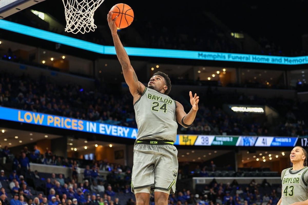 Dec 6, 2025; Memphis, Tennessee, USA; Baylor Bears guard Tounde Yessoufou (24) shoots the ball against the Memphis Tigers during the second half at FedExForum. Mandatory Credit: Wesley Hale-Imagn Images