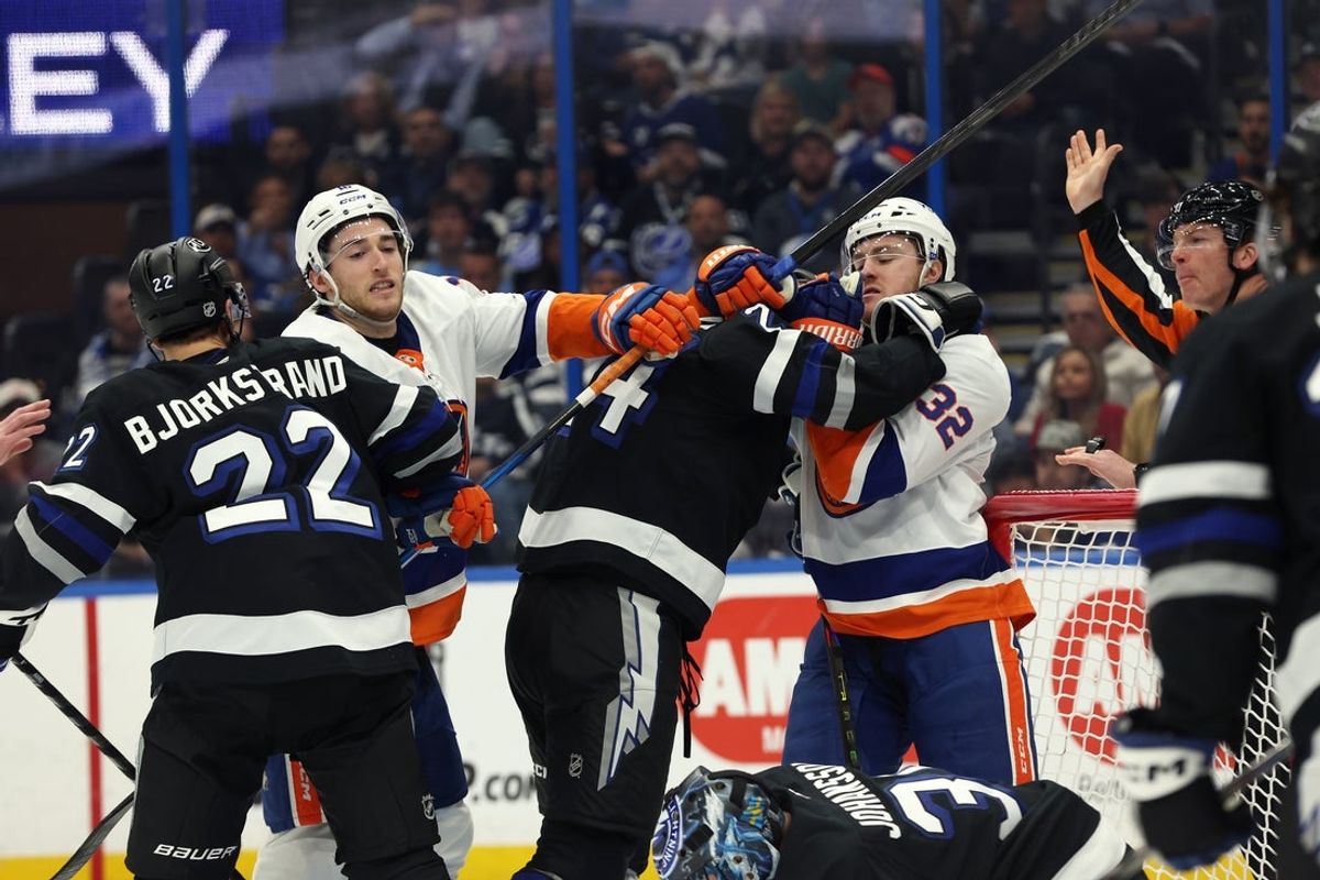 Dec 6, 2025; Tampa, Florida, USA; Tampa Bay Lightning right wing Oliver Bjorkstrand (22), defenseman Max Crozier (24), New York Islanders center Kyle MacLean (32) and center Marc Gatcomb (16) fight during the second period at Benchmark International Arena. Mandatory Credit: Kim Klement Neitzel-Imagn Images