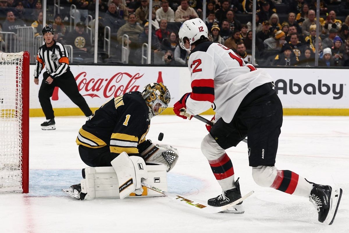 Dec 6, 2025; Boston, Massachusetts, USA; New Jersey Devils center Cody Glass (12) is stopped by Boston Bruins goaltender Jeremy Swayman (1) during the second period at TD Garden. Mandatory Credit: Winslow Townson-Imagn Images
