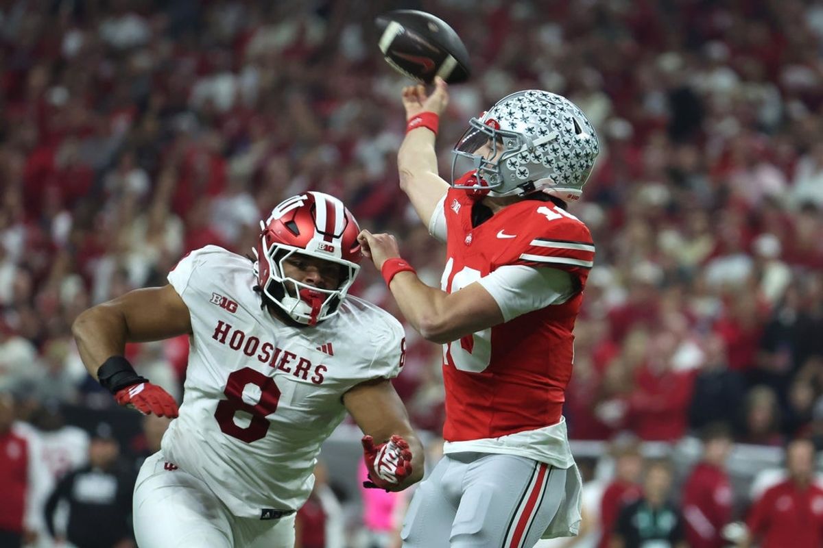 Dec 6, 2025; Indianapolis, IN, USA; Ohio State Buckeyes quarterback Julian Sayin (10) throws a pass against Indiana Hoosiers defensive lineman Stephen Daley (8) in the first quarter during the 2025 Big Ten championship game at Lucas Oil Stadium. Mandatory Credit: Trevor Ruszkowski-Imagn Images