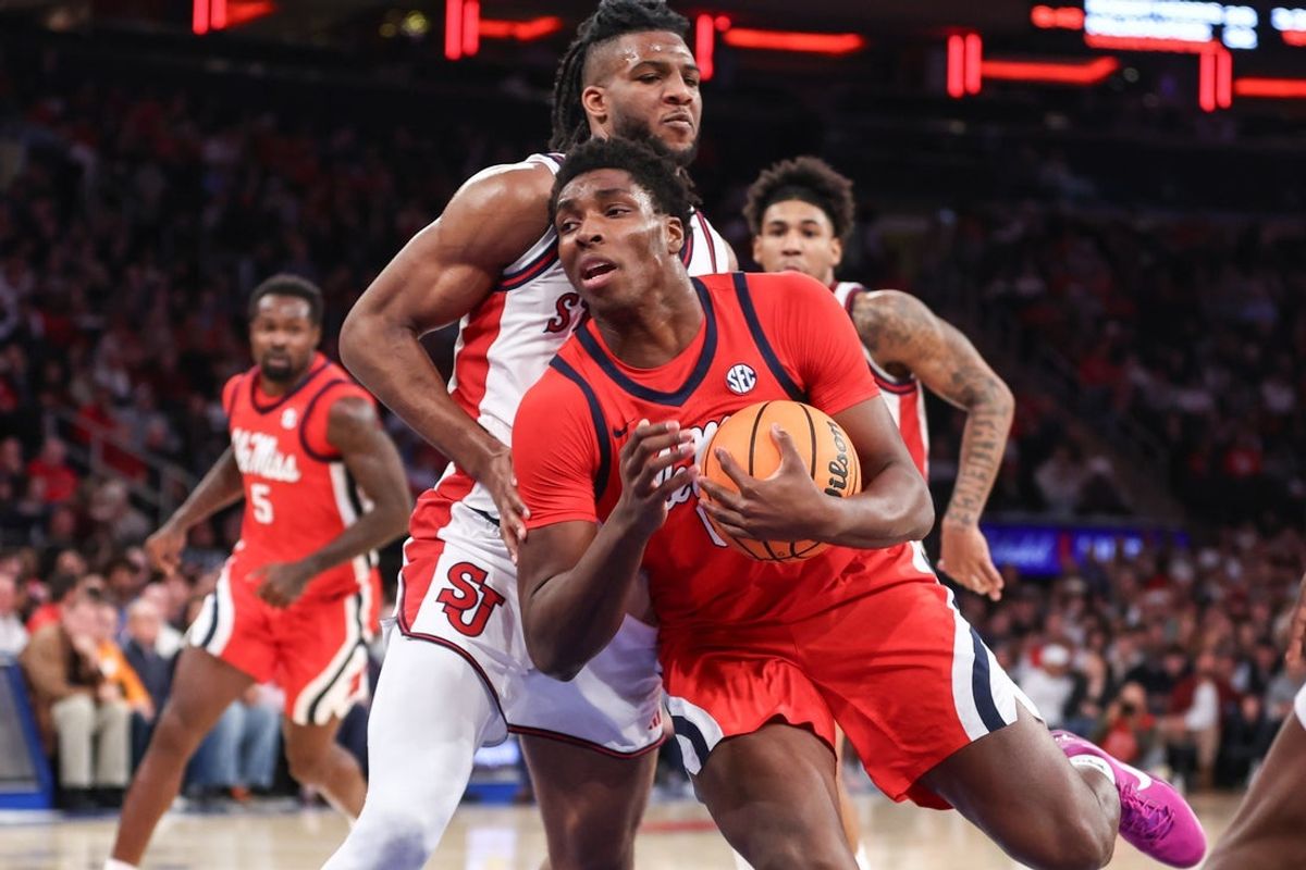 Dec 6, 2025; New York, New York, USA;  Mississippi Rebels forward Malik Dia (0) looks to post up against St. John's Red Storm forward Zuby Ejiofor (24) in the first half at Madison Square Garden. Mandatory Credit: Wendell Cruz-Imagn Images