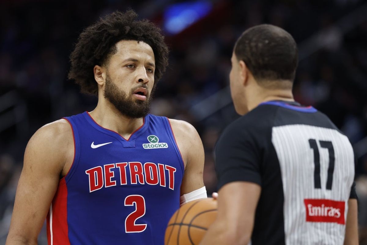 Dec 6, 2025; Detroit, Michigan, USA;  Detroit Pistons guard Cade Cunningham (2) talks to referee Jonathan Sterling in the first half against the Milwaukee Bucks at Little Caesars Arena. Mandatory Credit: Rick Osentoski-Imagn Images
