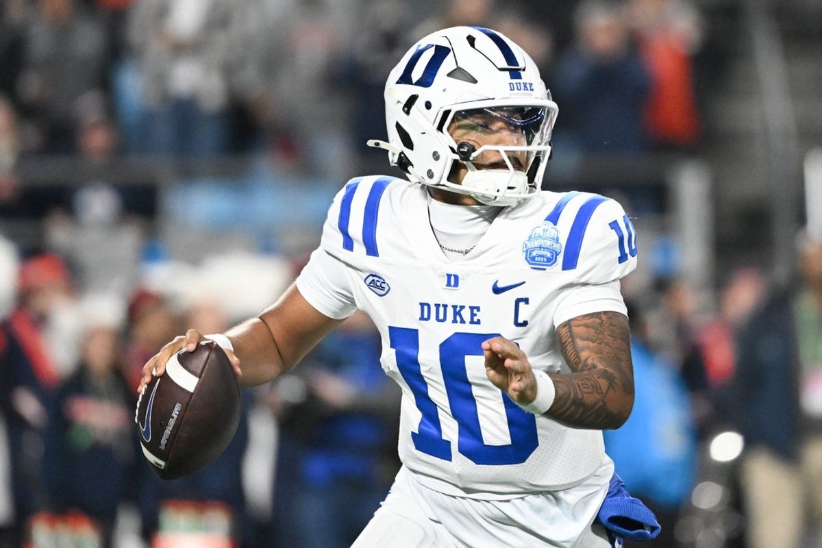 Dec 6, 2025; Charlotte, NC, USA; Duke Blue Devils quarterback Darian Mensah (10) looks to throw in the second quarter against the Virginia Cavaliers during the 2025 ACC Championship game at Bank of America Stadium. Mandatory Credit: Bob Donnan-Imagn Images