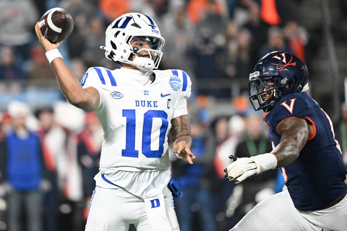 Dec 6, 2025; Charlotte, NC, USA; Duke Blue Devils quarterback Darian Mensah (10) throws in the second quarter against the Virginia Cavaliers during the 2025 ACC Championship game at Bank of America Stadium. Mandatory Credit: Bob Donnan-Imagn Images