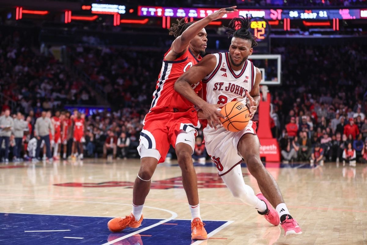 Dec 6, 2025; New York, New York, USA;  St. John's Red Storm forward Zuby Ejiofor (24) looks to post up against Mississippi Rebels guard Eduardo Klafke (8) in the second half at Madison Square Garden. Mandatory Credit: Wendell Cruz-Imagn Images
