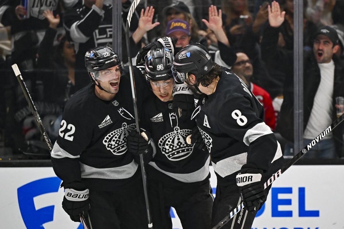 Dec 6, 2025; Los Angeles, California, USA; Los Angeles Kings left wing Andrei Kuzmenko (96), left wing Kevin Fiala (22), and defenseman Drew Doughty (8) celebrate after scoring a goal against the Chicago Blackhawks during the second period at Crypto.com Arena. Mandatory Credit: Jonathan Hui-Imagn Images