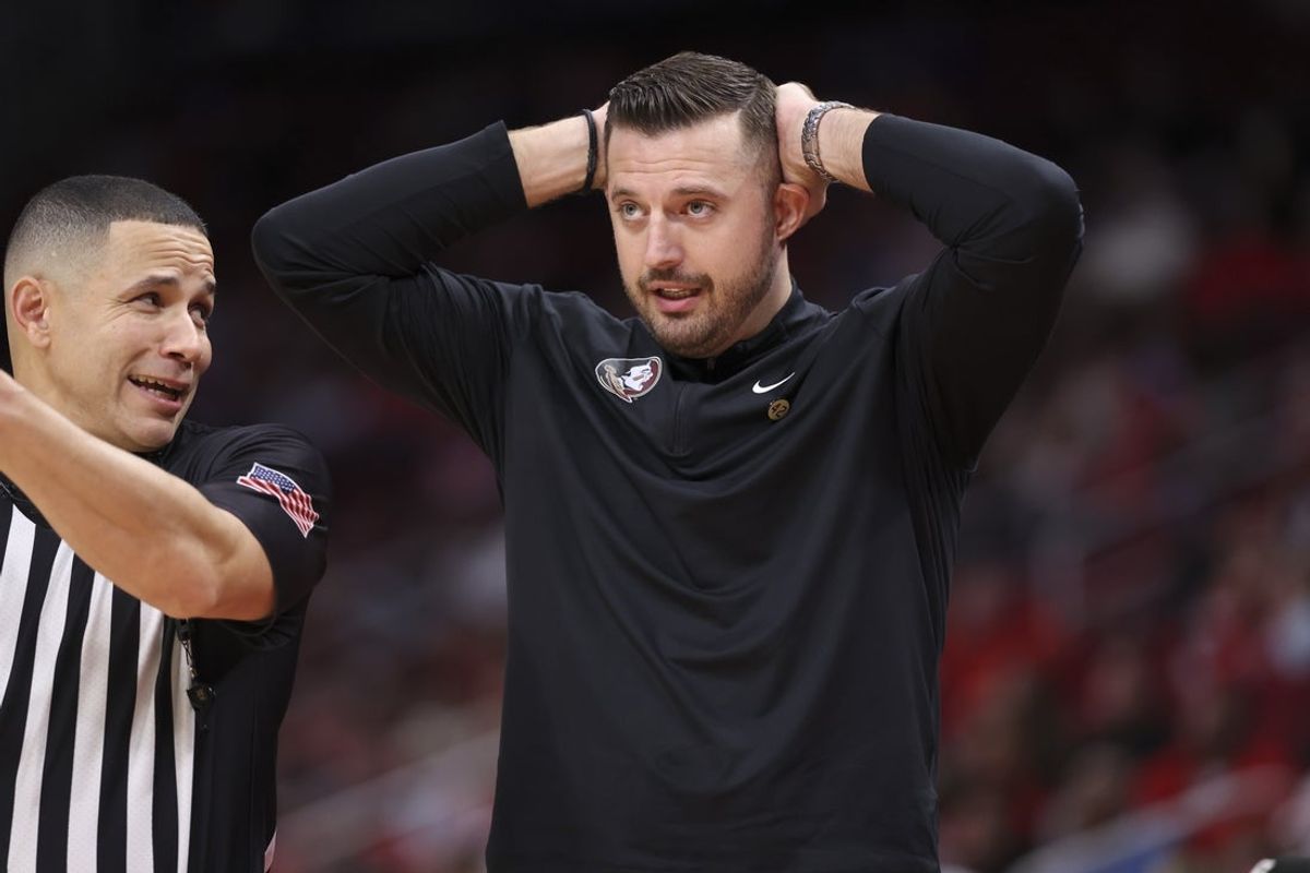 Dec 6, 2025; Houston, TX, USA; Florida State Seminoles head coach Luke Loucks reacts with an official during the second half against the Houston Cougars at Toyota Center. Mandatory Credit: Troy Taormina-Imagn Images