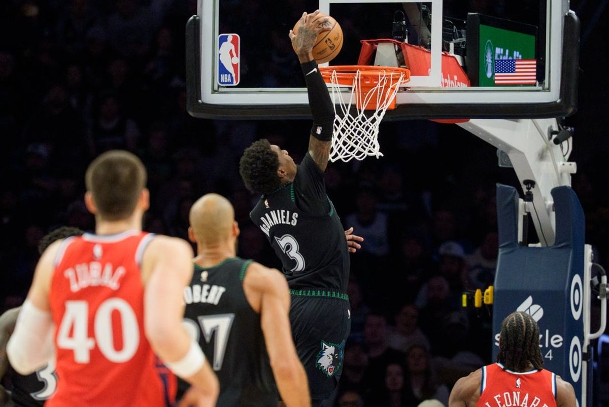 Dec 6, 2025; Minneapolis, Minnesota, USA; Minnesota Timberwolves forward Jaden McDaniels (3) dunks on the LA Clippers in the third quarter at Target Center. Mandatory Credit: Matt Blewett-Imagn Images