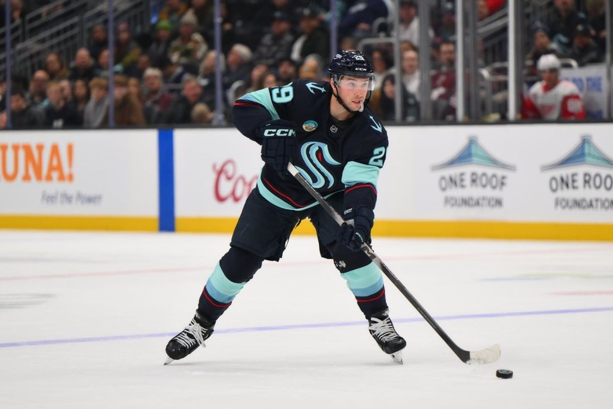 Dec 6, 2025; Seattle, Washington, USA; Seattle Kraken defenseman Vince Dunn (29) plays the puck during the second period against the Detroit Red Wings at Climate Pledge Arena. Mandatory Credit: Steven Bisig-Imagn Images