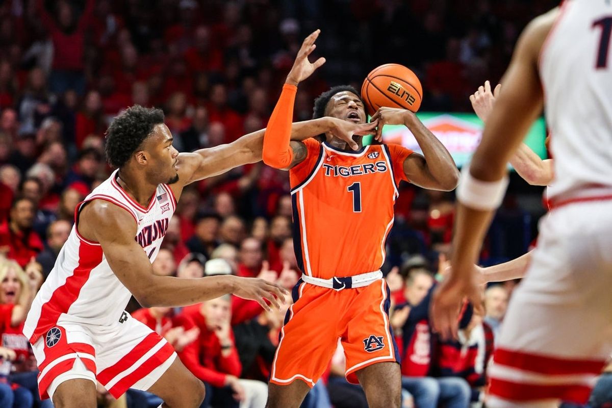 Dec 6, 2025; Tucson, Arizona, USA; Arizona Wildcats forward Tobe Awaka (30) knocks the ball out of the hands of Auburn Tigers guard Kevin Overton (1) during the first half of the game at McKale Memorial Center. Mandatory Credit: Aryanna Frank-Imagn Images