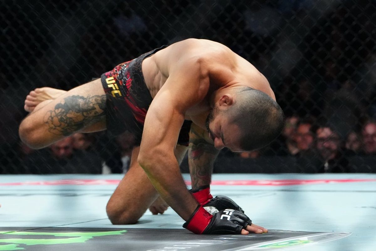 Dec 6, 2025; Las Vegas, Nevada, UNITED STATES; Alexandre Pantoja (red gloves) fights Joshua Van (blue gloves) during UFC 323 at T-Mobile Arena. Mandatory Credit: Stephen R. Sylvanie-Imagn Images