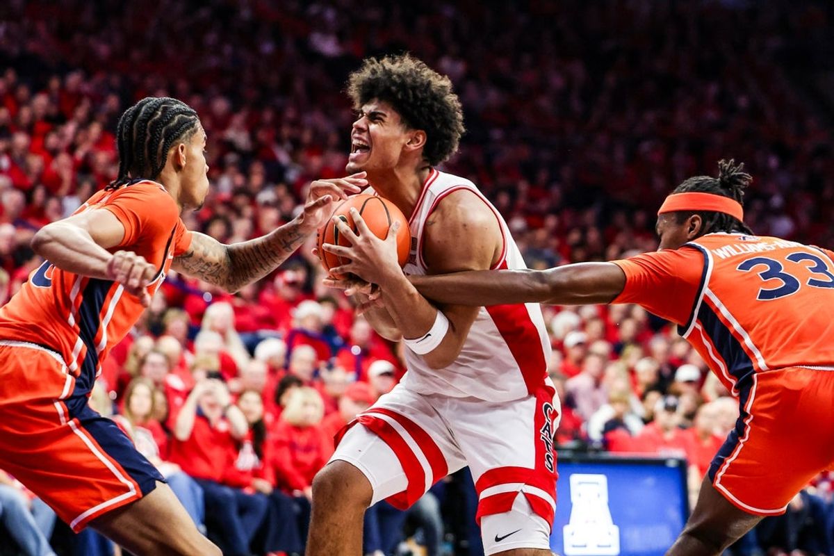 Dec 6, 2025; Tucson, Arizona, USA; Auburn Tigers forward Sebastian Williams-Adams (33) fouls Arizona Wildcats forward Koa Peat (10) during the second half of the game at McKale Memorial Center. Mandatory Credit: Aryanna Frank-Imagn Images