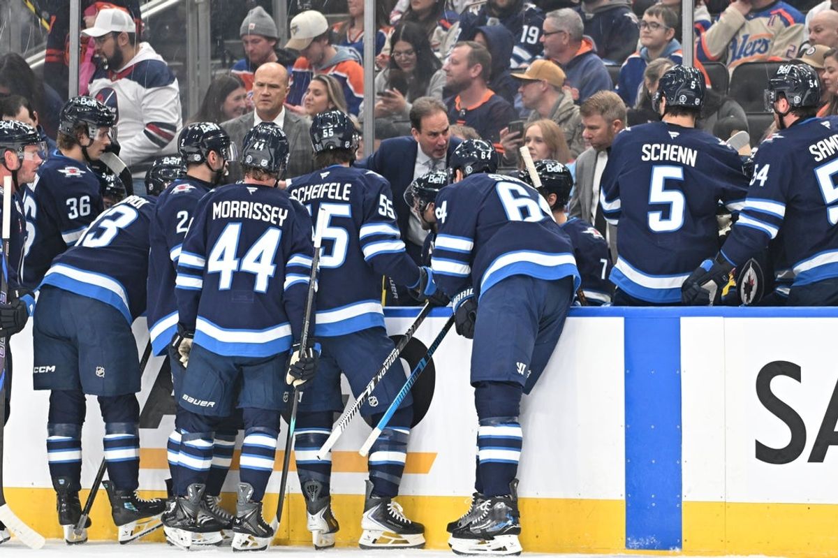 Dec 6, 2025; Edmonton, Alberta, CAN; Winnipeg Jets head coach Scott Arniel is seen on the players bench as the Edmonton Oilers take on the Winnipeg Jets during the first period at Rogers Place. Mandatory Credit: Walter Tychnowicz-Imagn Images