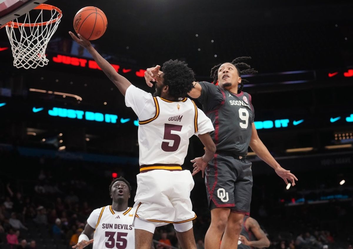 Oklahoma Sooners guard Nijel Pack (9) fouls ASU Sun Devils guard Moe Odum (5) on his layup at Mortgage Matchup Center on Dec. 6, 2025, in Phoenix, Arizona.