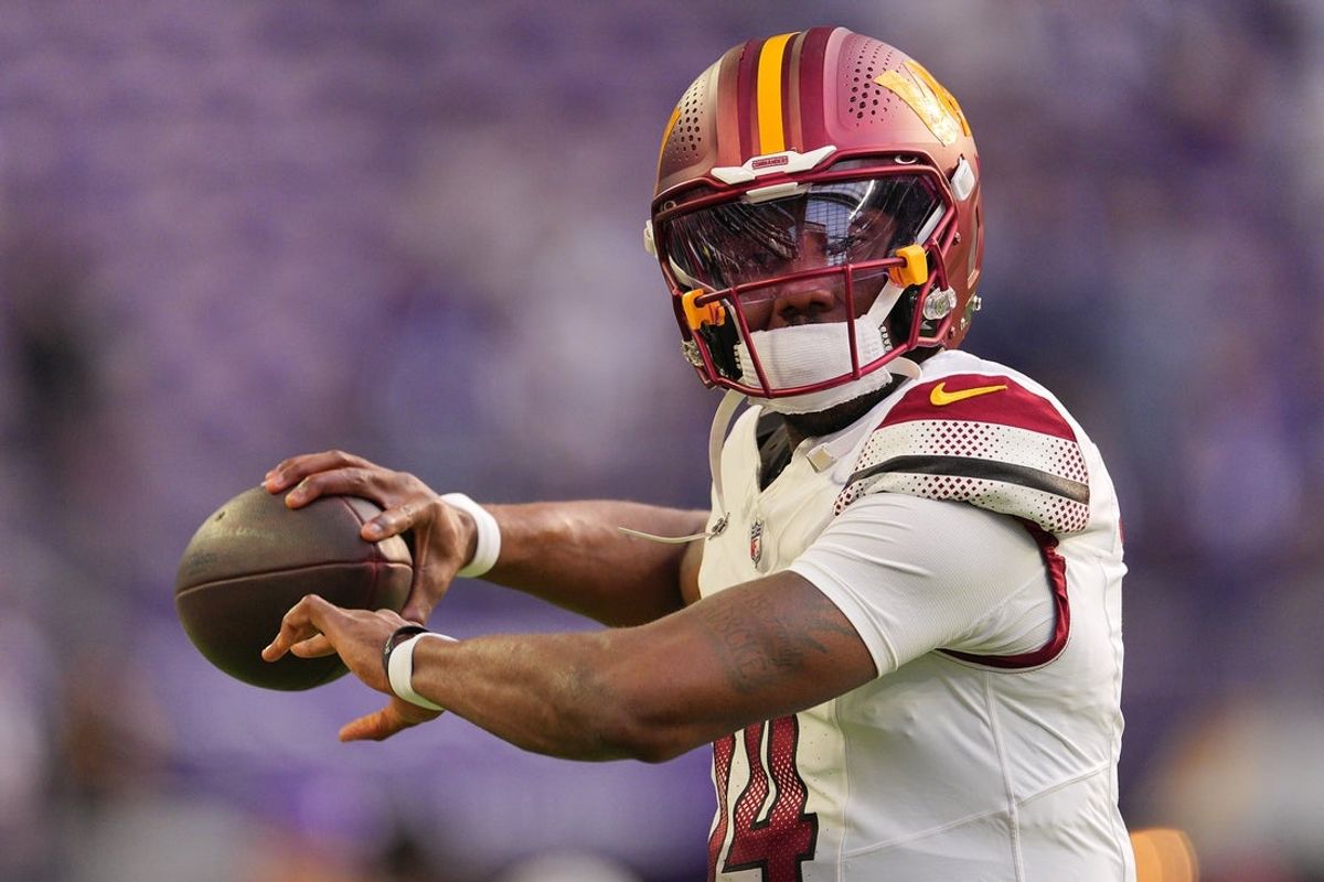 Dec 7, 2025; Minneapolis, Minnesota, USA; Washington Commanders quarterback Josh Johnson (14) practices before the game at U.S. Bank Stadium. Mandatory Credit: Brad Rempel-Imagn Images