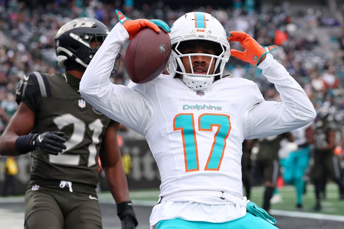 Dec 7, 2025; East Rutherford, New Jersey, USA; Miami Dolphins wide receiver Jaylen Waddle (17) reacts after making a catch for a touchdown against the New York Jets during the first half at MetLife Stadium. Mandatory Credit: Ed Mulholland-Imagn Images