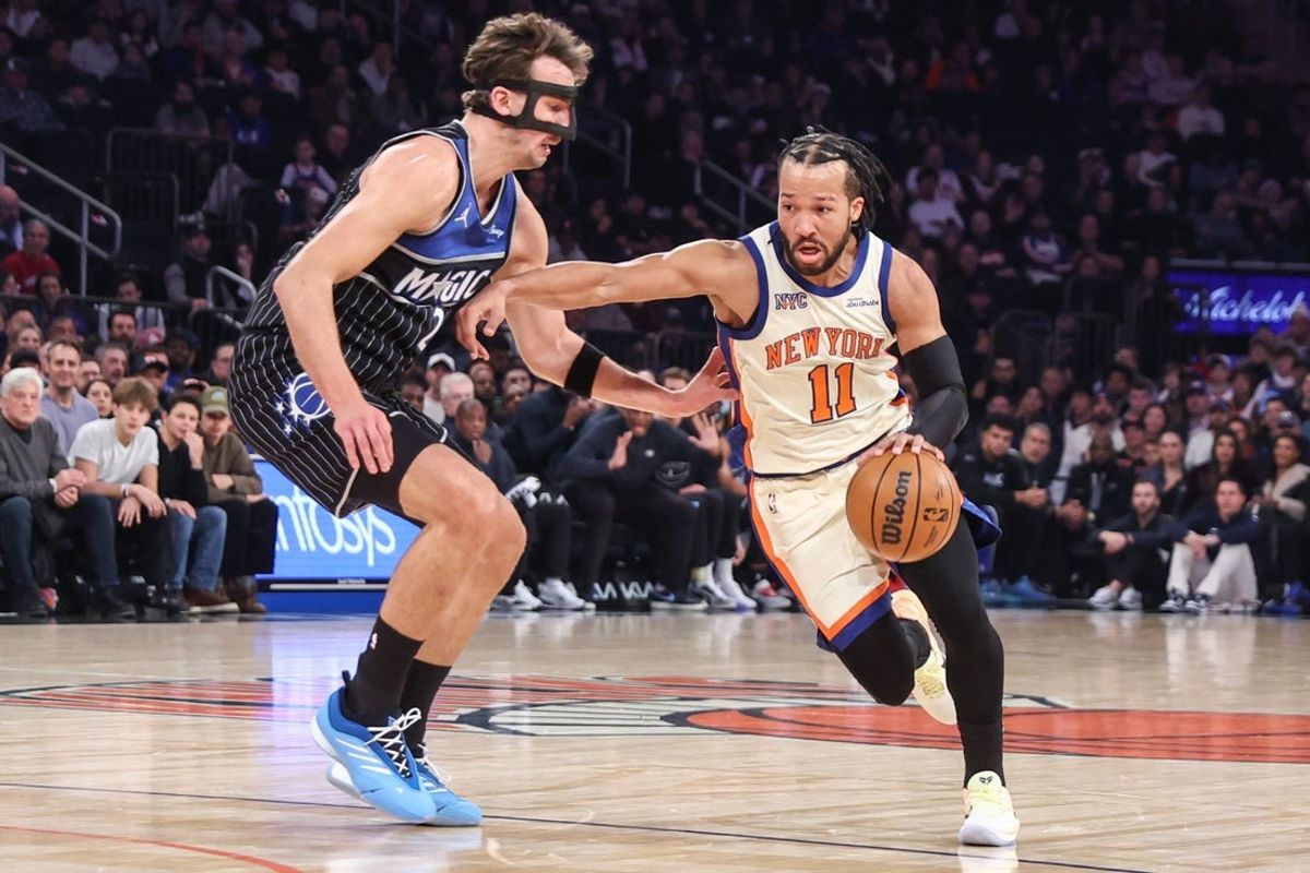 Dec 7, 2025; New York, New York, USA;  New York Knicks guard Jalen Brunson (11) looks to drive past Orlando Magic forward Franz Wagner (22) in the first quarter at Madison Square Garden. Mandatory Credit: Wendell Cruz-Imagn Images