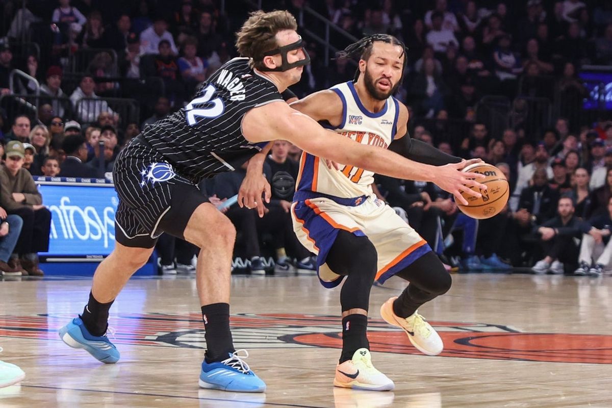 Dec 7, 2025; New York, New York, USA;  New York Knicks guard Jalen Brunson (11) looks to drive past Orlando Magic forward Franz Wagner (22) in the first quarter at Madison Square Garden. Mandatory Credit: Wendell Cruz-Imagn Images