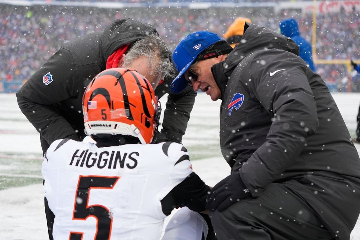 Dec 7, 2025; Orchard Park, New York, USA; Cincinnati Bengals wide receiver Tee Higgins (5) is attended to by medical staff in the second quarter against the Buffalo Bills at Highmark Stadium. Mandatory Credit: Gregory Fisher-Imagn Images