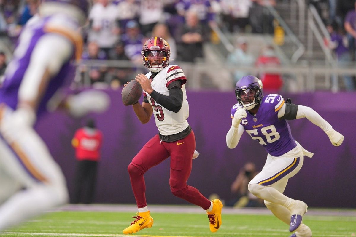 Dec 7, 2025; Minneapolis, Minnesota, USA; Washington Commanders quarterback Jayden Daniels (5) drops back to pass during the second half at U.S. Bank Stadium. Mandatory Credit: Brad Rempel-Imagn Images