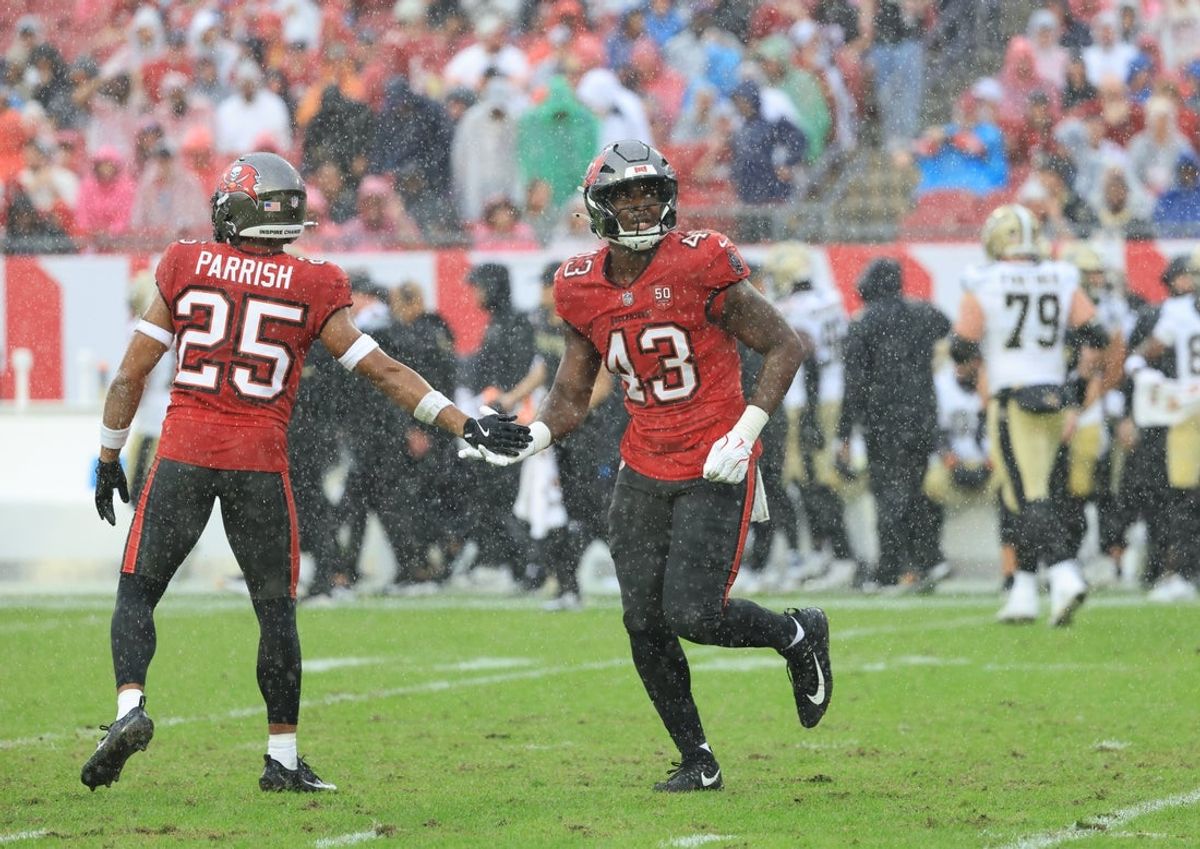 Dec 7, 2025; Tampa, Florida, USA; Tampa Bay Buccaneers linebacker Chris Braswell (43) high-fives cornerback Jacob Parrish (25) after sacking New Orleans Saints quarterback Tyler Shough (6, not pictured) during the second quarter at Raymond James Stadium. Mandatory Credit: Kim Klement Neitzel-Imagn Images