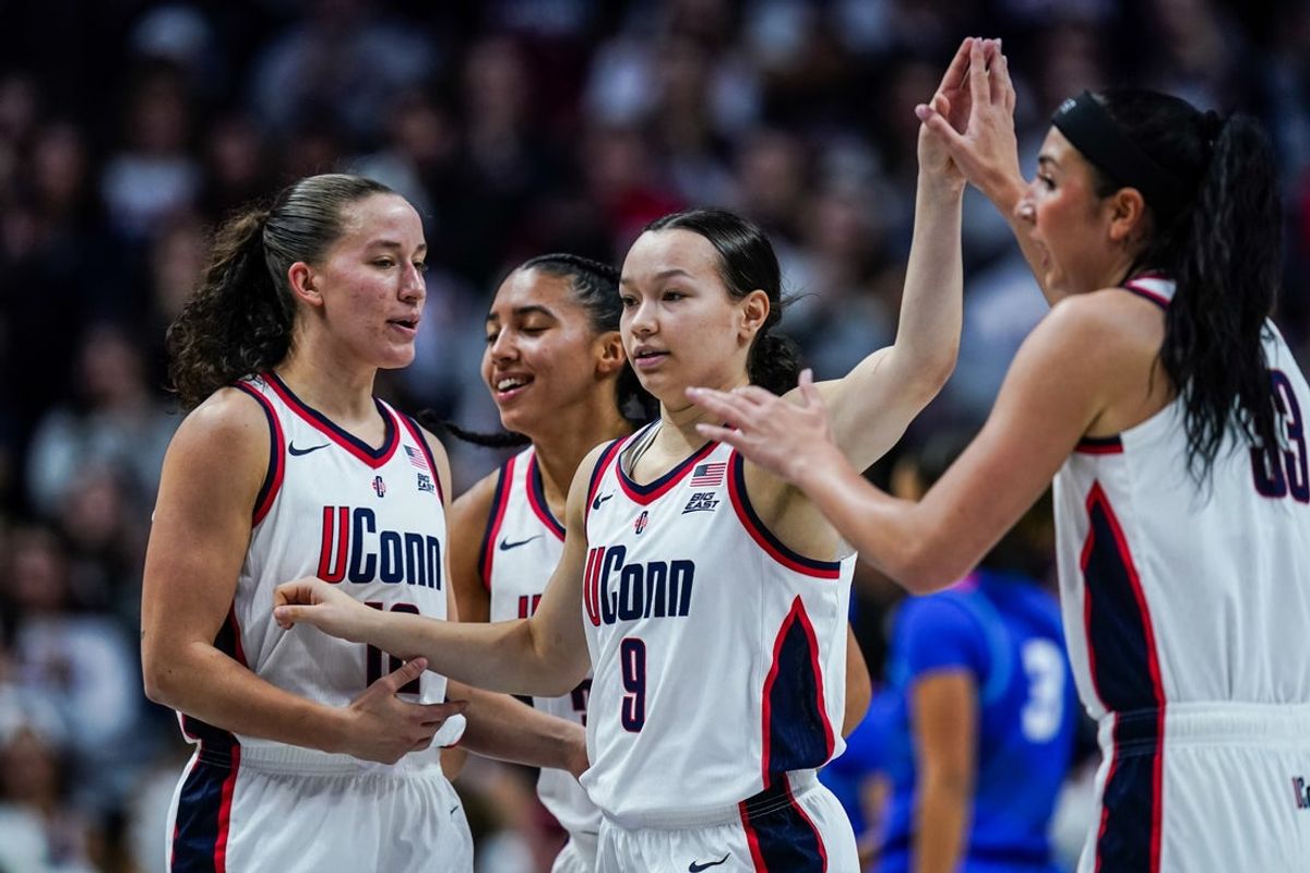 Dec 7, 2025; Storrs, Connecticut, USA; UConn Huskies guard Kayleigh Heckel (9) reacts with teammates guard Ashlynn Shade (12), guard Azzi Fudd (35) and guard Caroline Ducharme (33) aft a play against the DePaul Blue Demons in the first half at Harry A. Gampel Pavilion. Mandatory Credit: David Butler II-Imagn Images