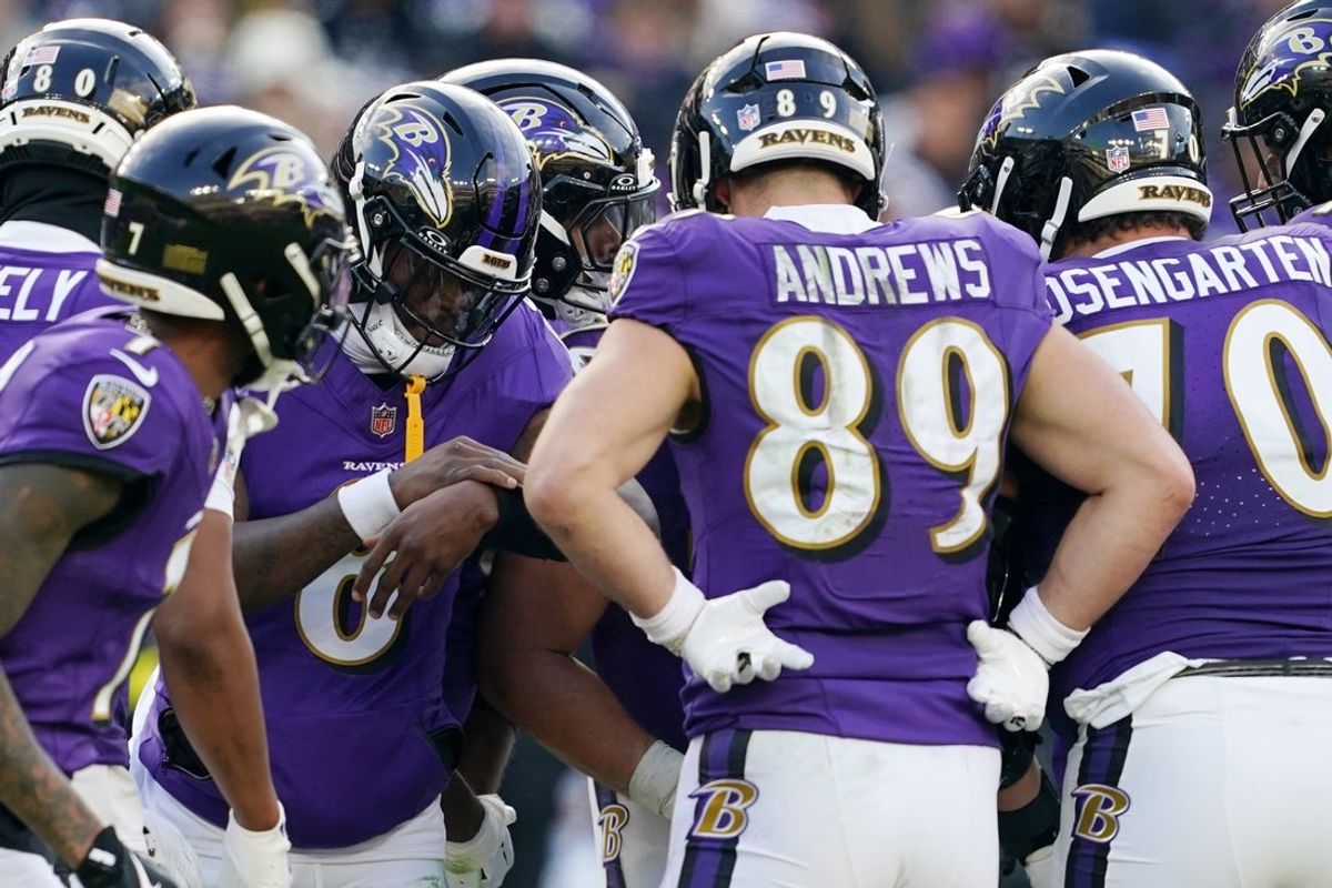 Dec 7, 2025; Baltimore, Maryland, USA; Baltimore Ravens quarterback Lamar Jackson (8) huddles with teammates before a play Pittsburgh Steelers during the second half at M&T Bank Stadium. Mandatory Credit: Mitch Stringer-Imagn Images