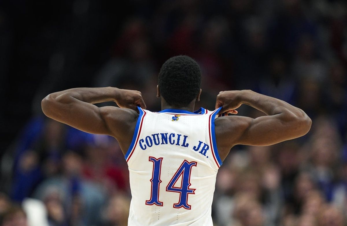 Dec 7, 2025; Kansas City, Missouri, USA; Kansas Jayhawks guard Melvin Council Jr. (14) celebrates after defeating the Missouri Tigers at T-Mobile Center. Mandatory Credit: Jay Biggerstaff-Imagn Images