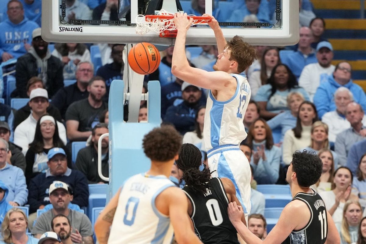 Dec 7, 2025; Chapel Hill, North Carolina, USA; North Carolina Tar Heels center Henri Veesaar (13) scores in the first half at Dean E. Smith Center. Mandatory Credit: Bob Donnan-Imagn Images