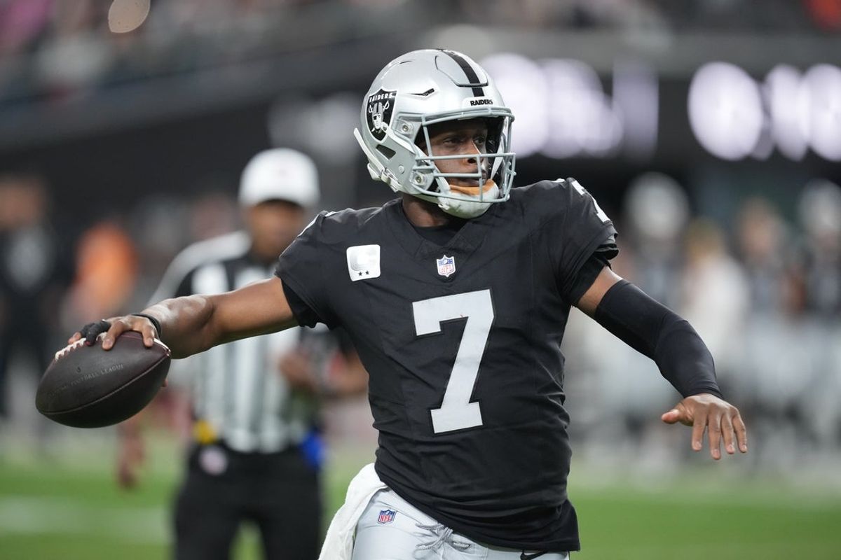 Dec 7, 2025; Paradise, Nevada, USA;  Las Vegas Raiders quarterback Geno Smith (7) looks to throw downfield against the Denver Broncos during the second half at Allegiant Stadium. Mandatory Credit: Kirby Lee-Imagn Images