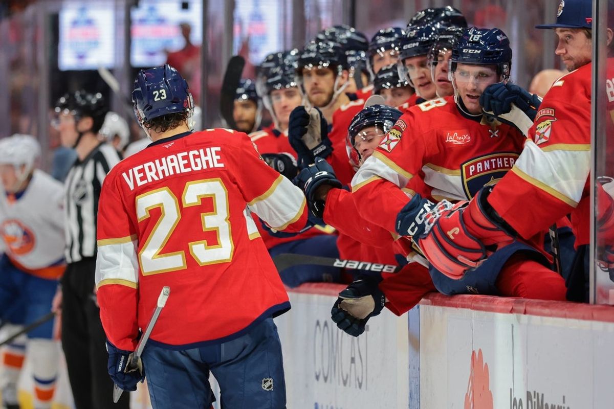 Dec 7, 2025; Sunrise, Florida, USA; Florida Panthers center Carter Verhaeghe (23) celebrates with teammates after scoring against the New York Islanders during the second period at Amerant Bank Arena. Mandatory Credit: Sam Navarro-Imagn Images
