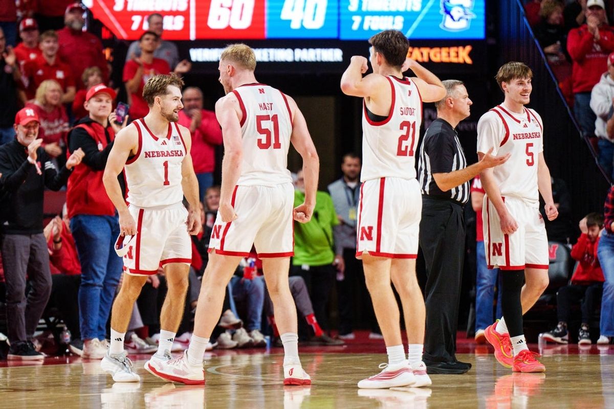 Dec 7, 2025; Lincoln, Nebraska, USA; Nebraska Cornhuskers guard Sam Hoiberg (1), forward Rienk Mast (51) and forward Pryce Sandfort (21) celebrate after a three-point basket by Hoiberg against the Creighton Bluejays during the second half at Pinnacle Bank Arena. Mandatory Credit: Dylan Widger-Imagn Images