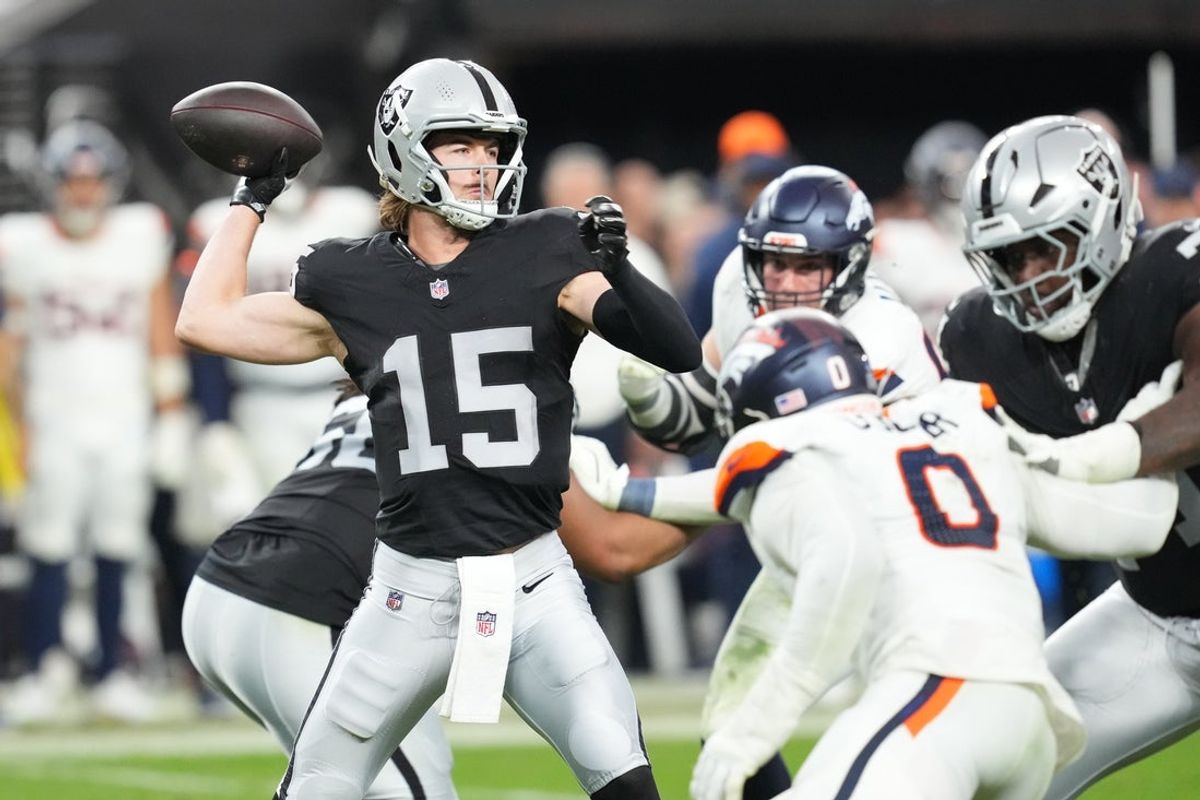 Dec 7, 2025; Paradise, Nevada, USA;  Las Vegas Raiders quarterback Kenny Pickett (15) throws downfield against the Denver Broncos during the second half at Allegiant Stadium. Mandatory Credit: Stephen R. Sylvanie-Imagn Images