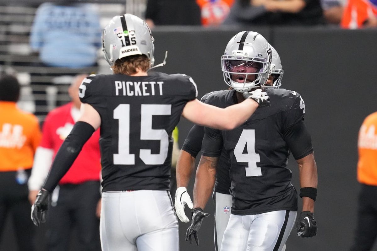 Dec 7, 2025; Paradise, Nevada, USA;  Las Vegas Raiders quarterback Kenny Pickett (15) reacts with wide receiver Shedrick Jackson (4) as the pair connected for a touchdown against the Denver Broncos during the second half at Allegiant Stadium. Mandatory Credit: Stephen R. Sylvanie-Imagn Images