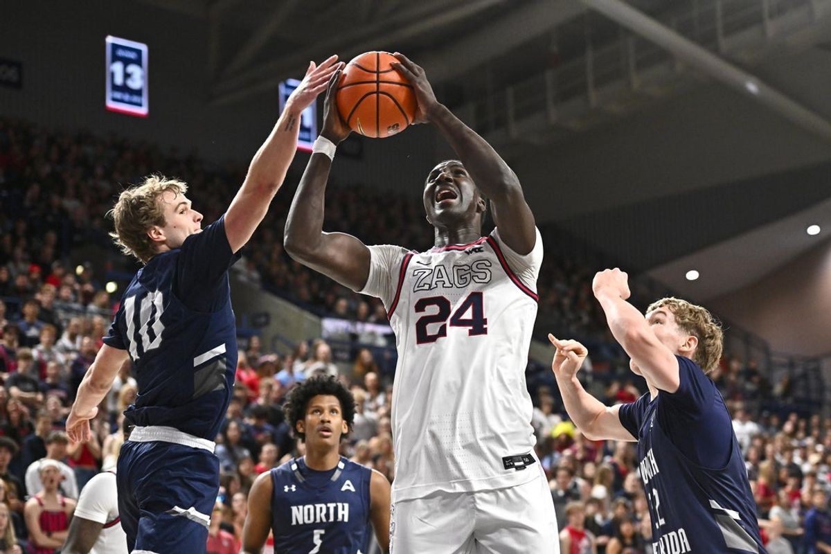 Dec 7, 2025; Spokane, Washington, USA; Gonzaga Bulldogs center Ismaila Diagne (24) rebounds the ball against North Florida Ospreys guard Kent Jackson (10) in the first half at McCarthey Athletic Center. Mandatory Credit: James Snook-Imagn Images