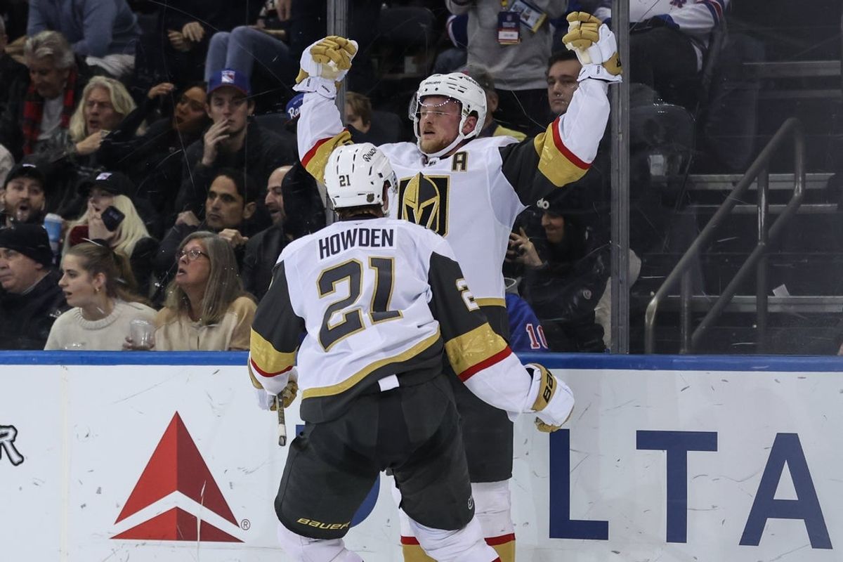 Dec 7, 2025; New York, New York, USA;  Vegas Golden Knights center Jack Eichel (9) celebrates with center Brett Howden (21) after scoring the game winning goal in overtime to defeat the New York Rangers 3-2 at Madison Square Garden. Mandatory Credit: Wendell Cruz-Imagn Images