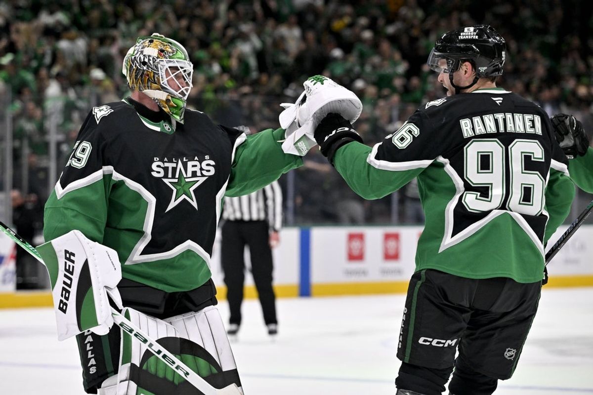 Dec 7, 2025; Dallas, Texas, USA; Dallas Stars goaltender Jake Oettinger (29) and right wing Mikko Rantanen (96) celebrate after the Stars defeat the Pittsburgh Penguins at American Airlines Center. Mandatory Credit: Jerome Miron-Imagn Images