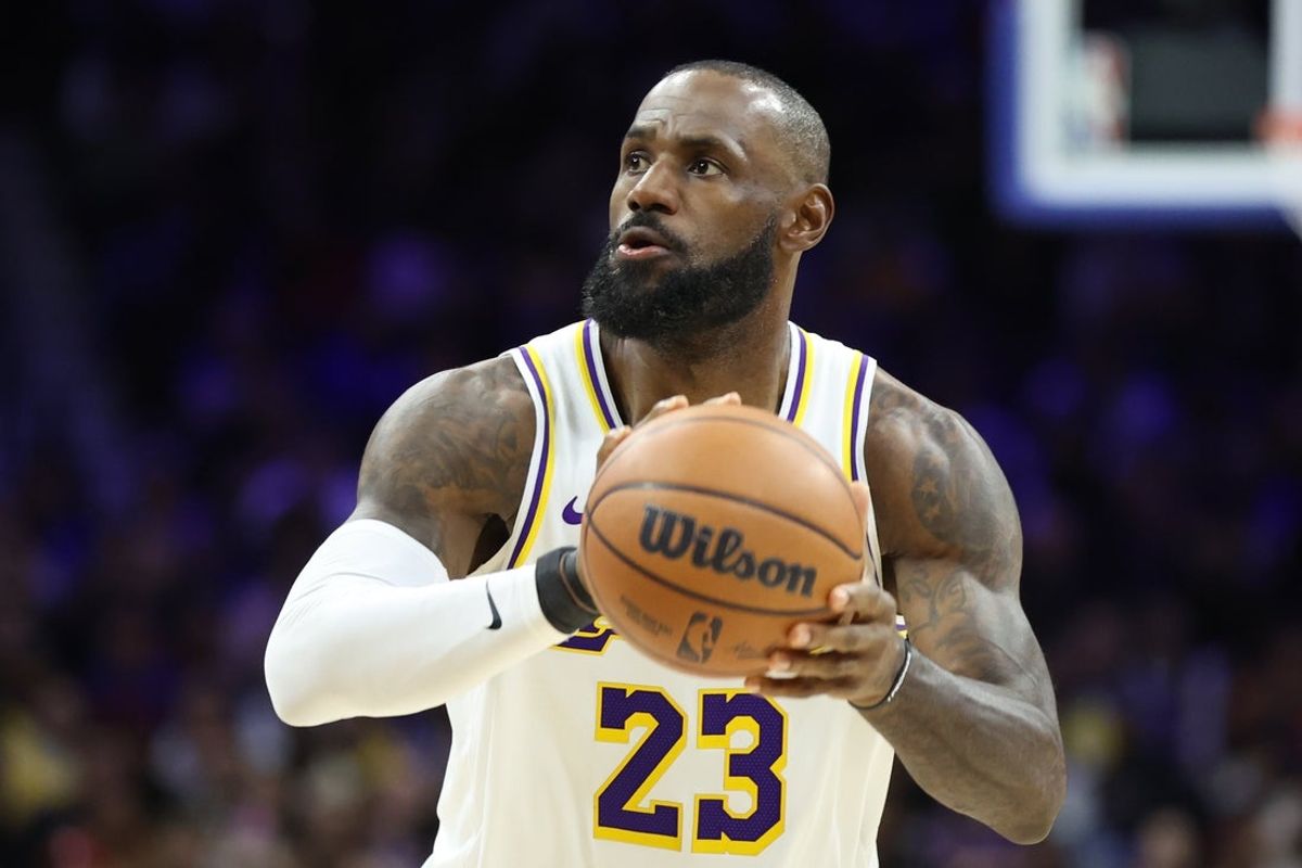 Dec 7, 2025; Philadelphia, Pennsylvania, USA; Los Angeles Lakers forward Lebron James (23) shoots against the Philadelphia 76ers during the fourth quarter at Xfinity Mobile Arena. Mandatory Credit: Bill Streicher-Imagn Images