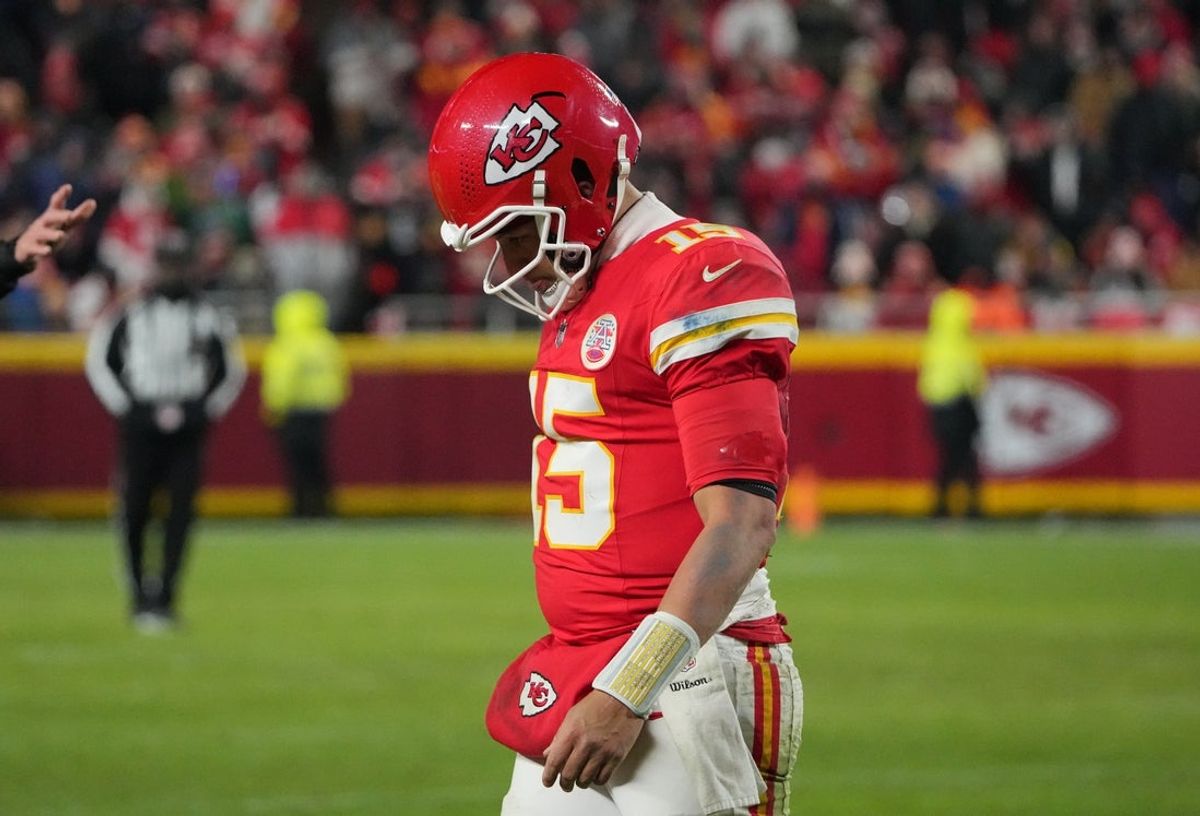 Dec 7, 2025; Kansas City, Missouri, USA; Kansas City Chiefs quarterback Patrick Mahomes (15) lowers his head during the fourth quarter against the Houston Texans at GEHA Field at Arrowhead Stadium. Mandatory Credit: Denny Medley-Imagn Images