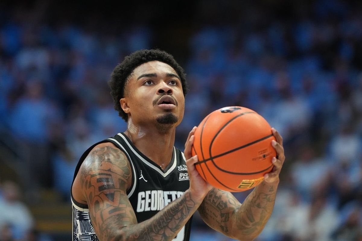 Dec 7, 2025; Chapel Hill, North Carolina, USA;  Georgetown Hoyas guard Langston Love (13) shoots a free throw in the first half at Dean E. Smith Center. Mandatory Credit: Bob Donnan-Imagn Images