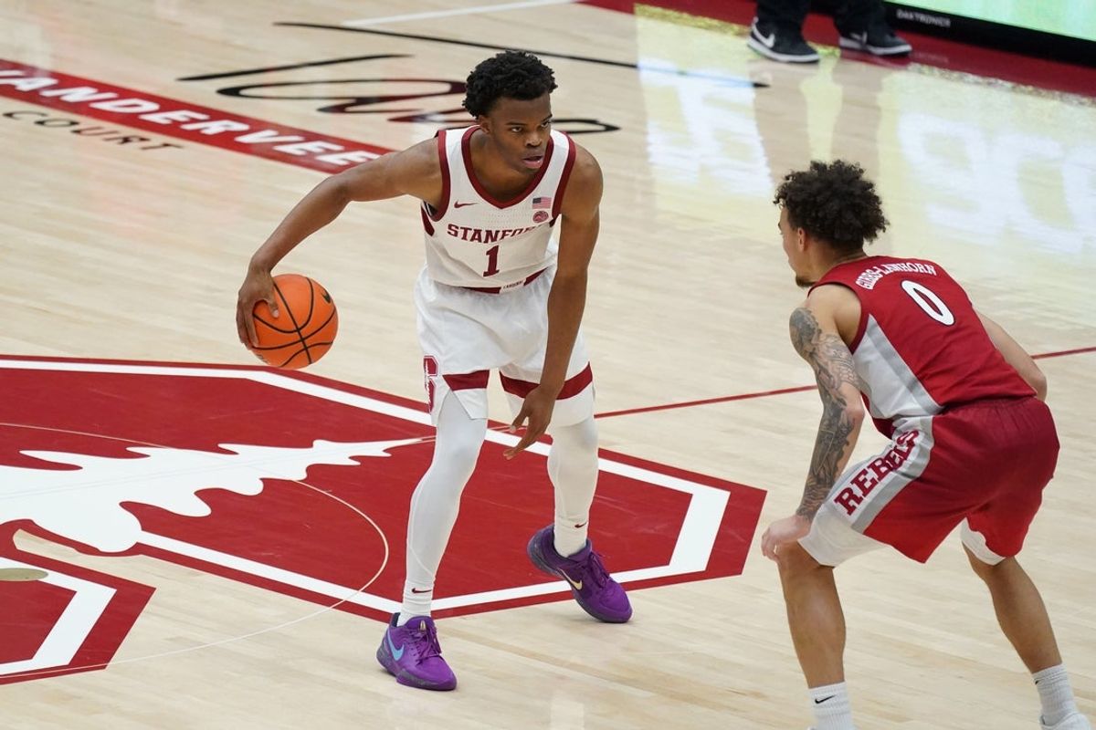Dec 7, 2025; Stanford, California, USA;  Stanford Cardinal guard Ebuka Okorie (1) dribbles upcourt against UNLV Runnin' Rebels guard Dra Gibbs-Lawhorn (0) in the second half at Maples Pavilion. Mandatory Credit: David Gonzales-Imagn Images