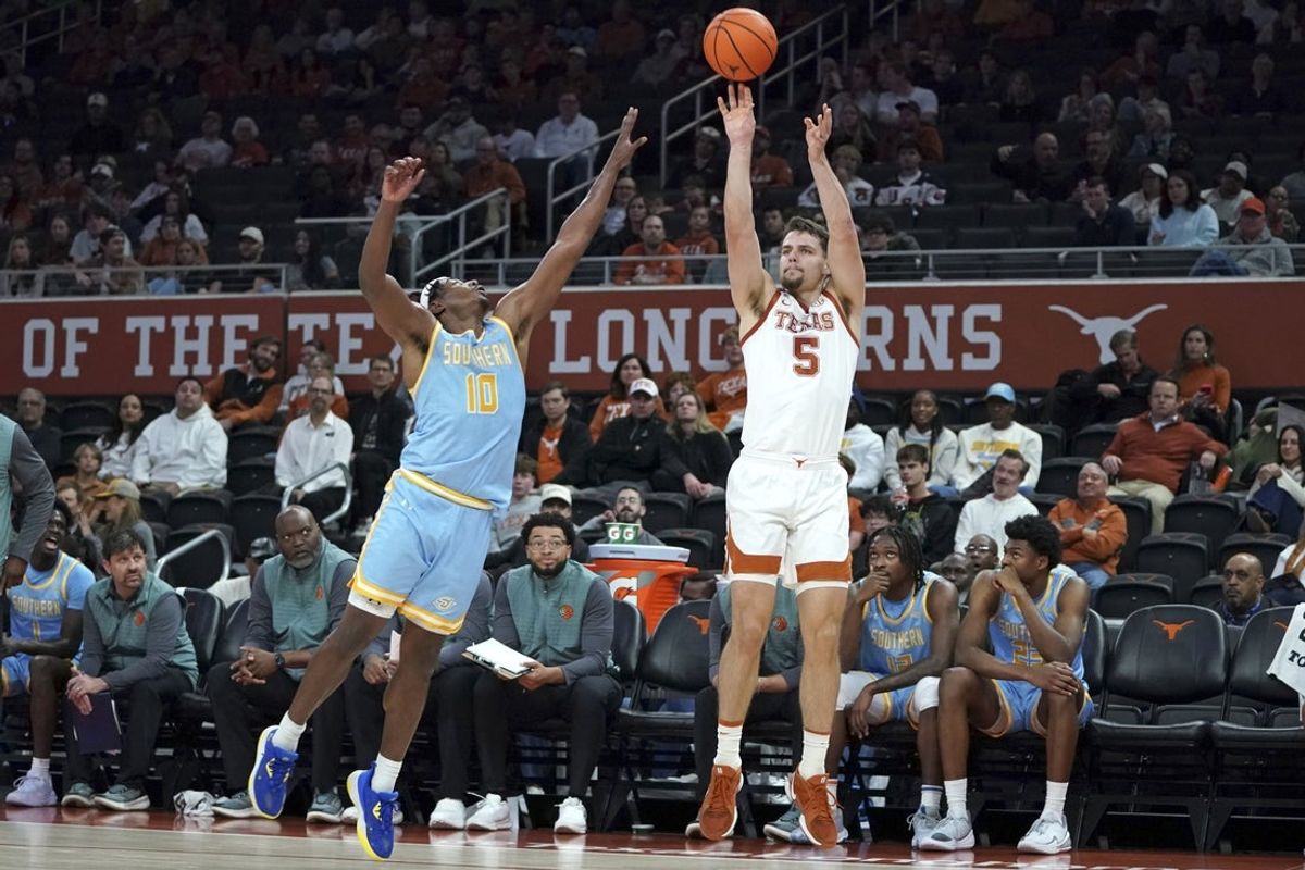 Dec 8, 2025; Austin, Texas, USA; Texas Longhorns forward Camden Heide (5) makes a three point basket against Southern University Jaguars guard Michael Jacobs (10) during the first half at Moody Center. Mandatory Credit: Dustin Safranek-Imagn Images