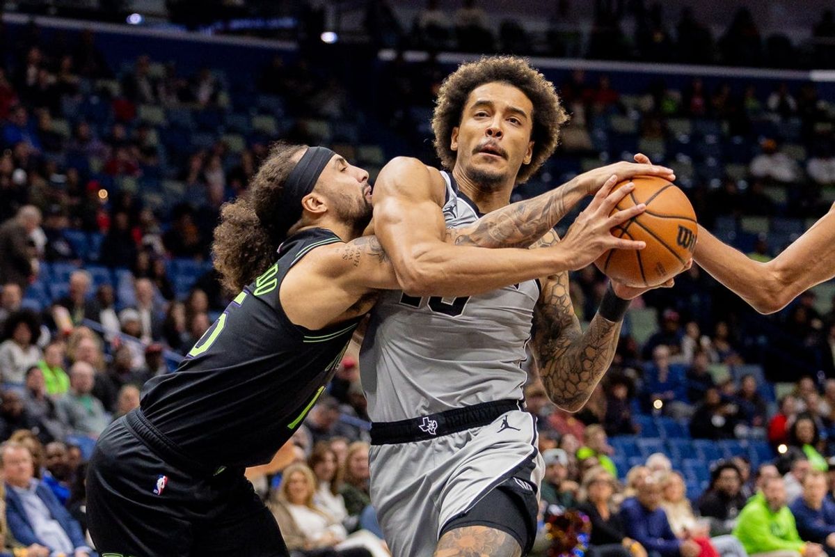 Dec 8, 2025; New Orleans, Louisiana, USA;  San Antonio Spurs forward Jeremy Sochan (10) brings the ball up court and is stripped by New Orleans Pelicans guard Jose Alvarado (15) during the first half at Smoothie King Center. Mandatory Credit: Stephen Lew-Imagn Images